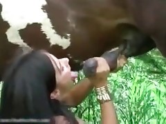 Horny brunette gives head for this horse
